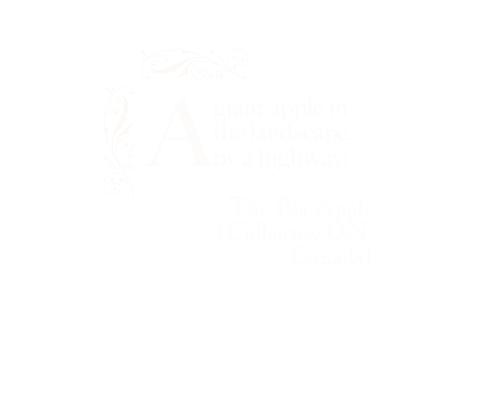 A giant apple in the landscape, by a highway: The Big Apple (Colborne, ON, Canada).
